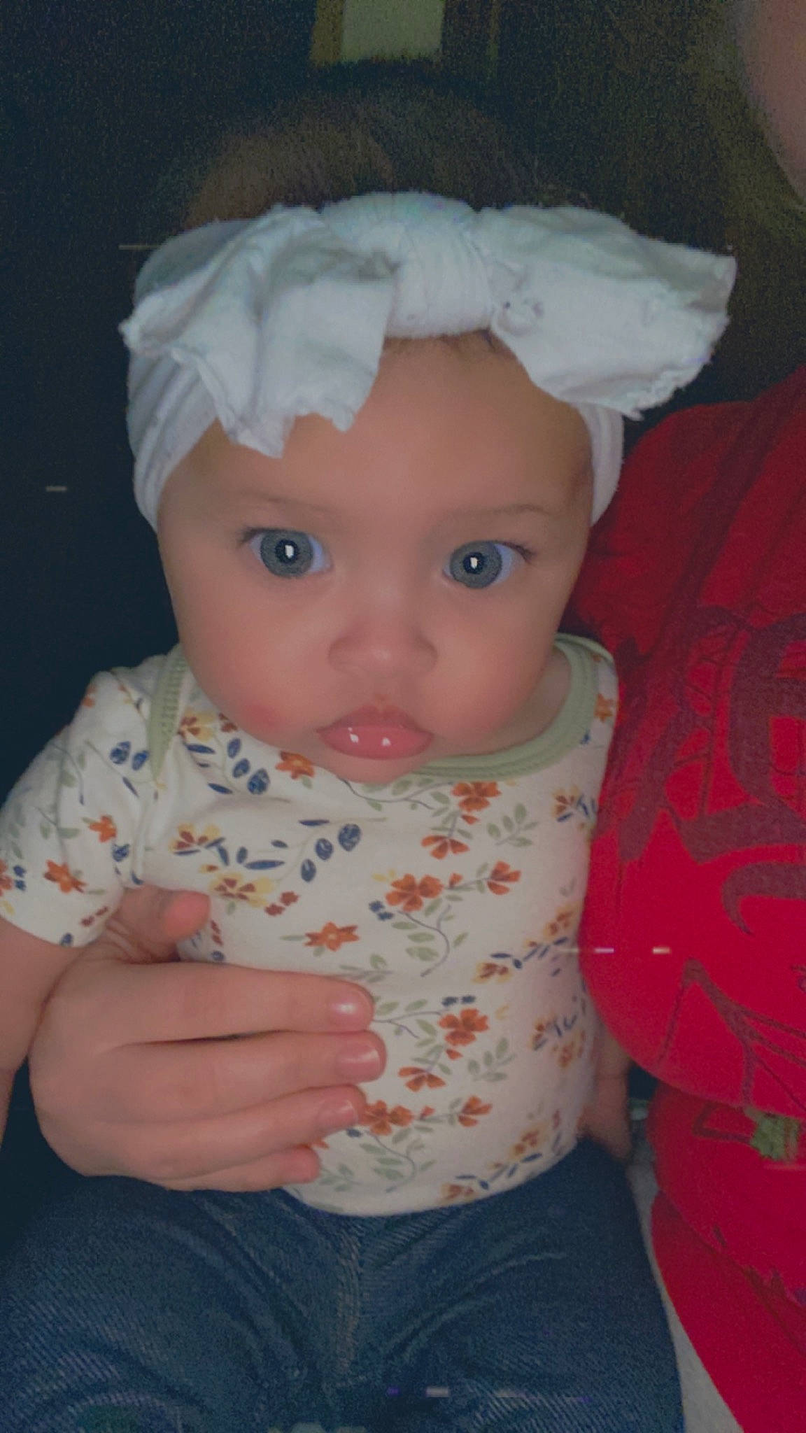 Jazlyn is registered to the contest to win money with this photo: baby, baby_toddler_clothing, cheek, child, doll, eye, eyelash, fashion_accessory, gesture, headwear, iris, lip, nail, nose, pattern, person, sitting, skin, sleeve, thumb
