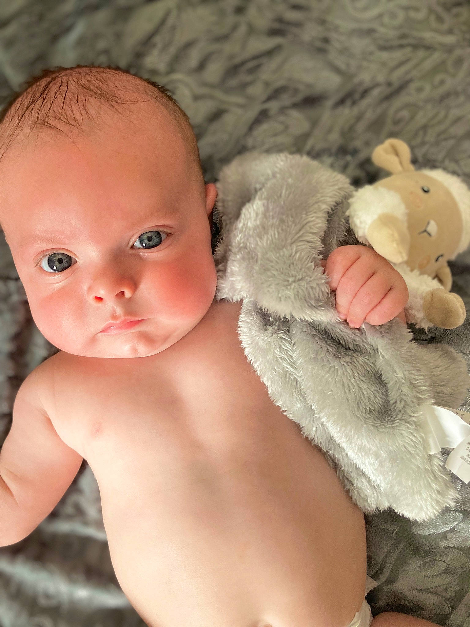 Jordan is registered to the contest to win money with this photo: baby, cheek, chest, child, eye, eyelash, finger, happy, head, human_body, lip, mammal, nose, person, skin, stomach, thumb, toddler, toy, trunk
