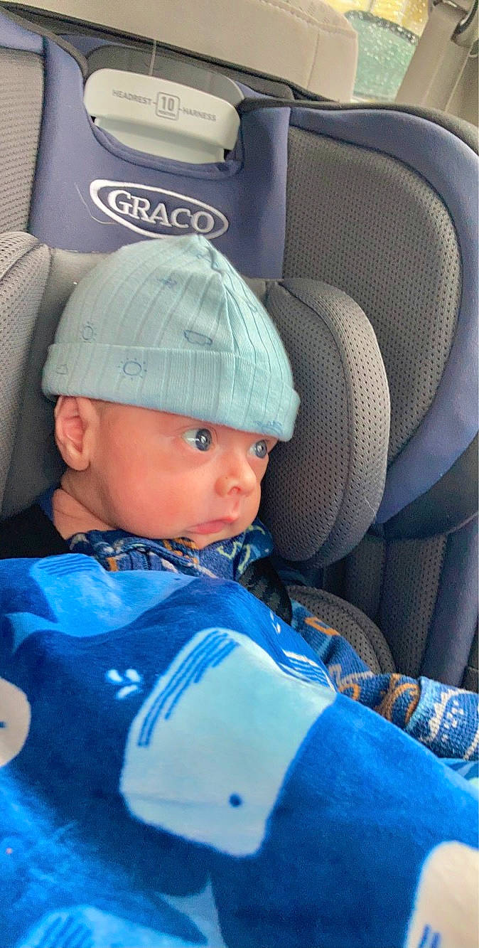 Jordan is registered to the contest to win money with this photo: auto_part, automotive_design, blue, cap, car_seat, car_seat_cover, child, electric_blue, fashion_accessory, head_restraint, headgear, headwear, helmet, luxury_vehicle, motor_vehicle, person, personal_protective_equipment, sleeve, sports_gear, toddler
