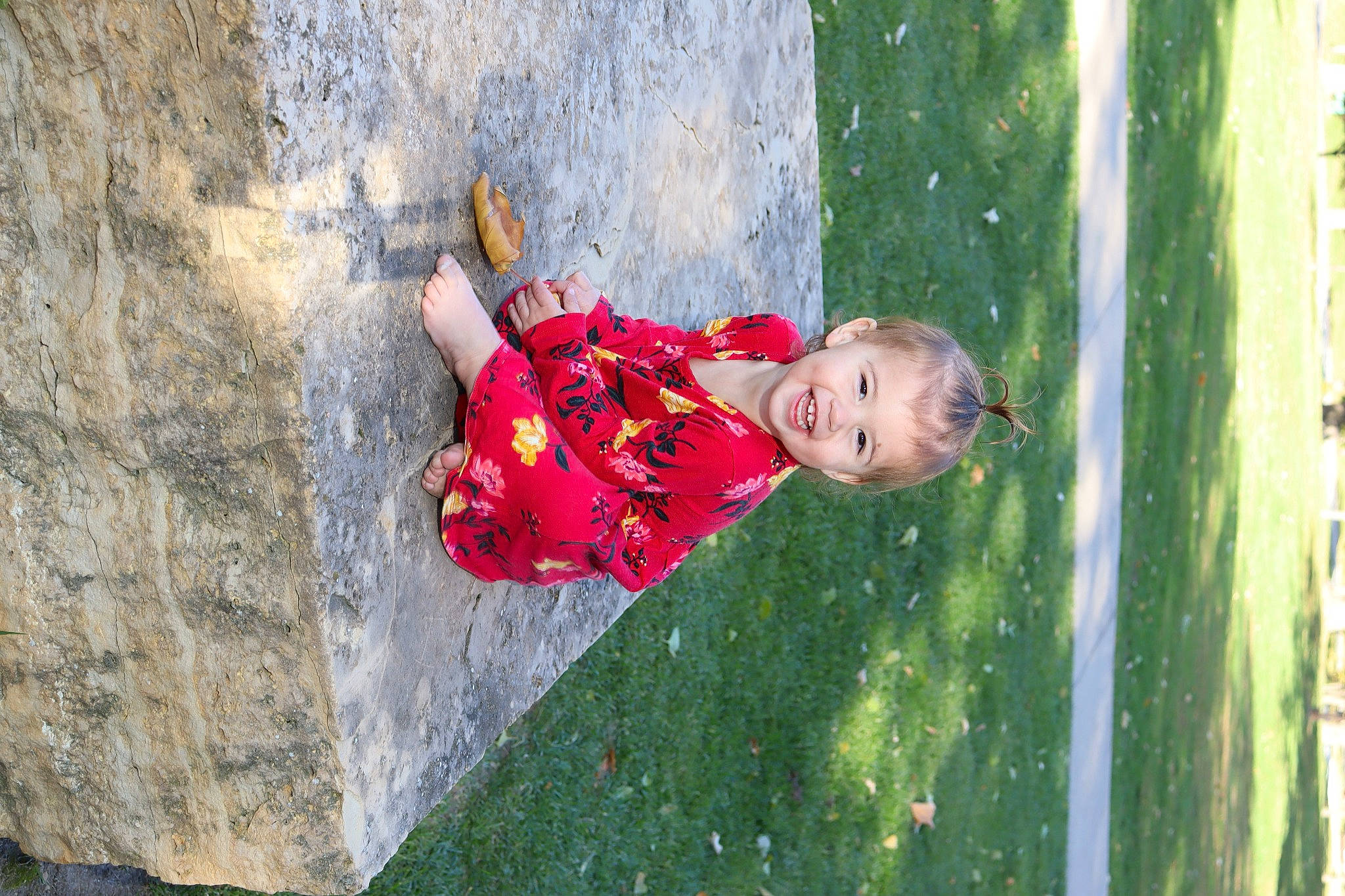 Zariyah is registered to the contest to win money with this photo: adventure, baby, child, concrete, dress, fun, grass, happy, joy, leisure, people_in_nature, person, plant, play, recreation, rock, rock_climbing_equipment, sport_climbing, toddler, tree