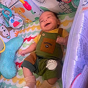 Nathaniel joined the competition — help win amazing prizes! baby, smiling, totoro, overalls, play_mat, toy, colorful, animal_illustrations, infant, socks, happy, cute, child, indoor, soft_toys, patterned, lying_down, small_child, fabric, comfortable