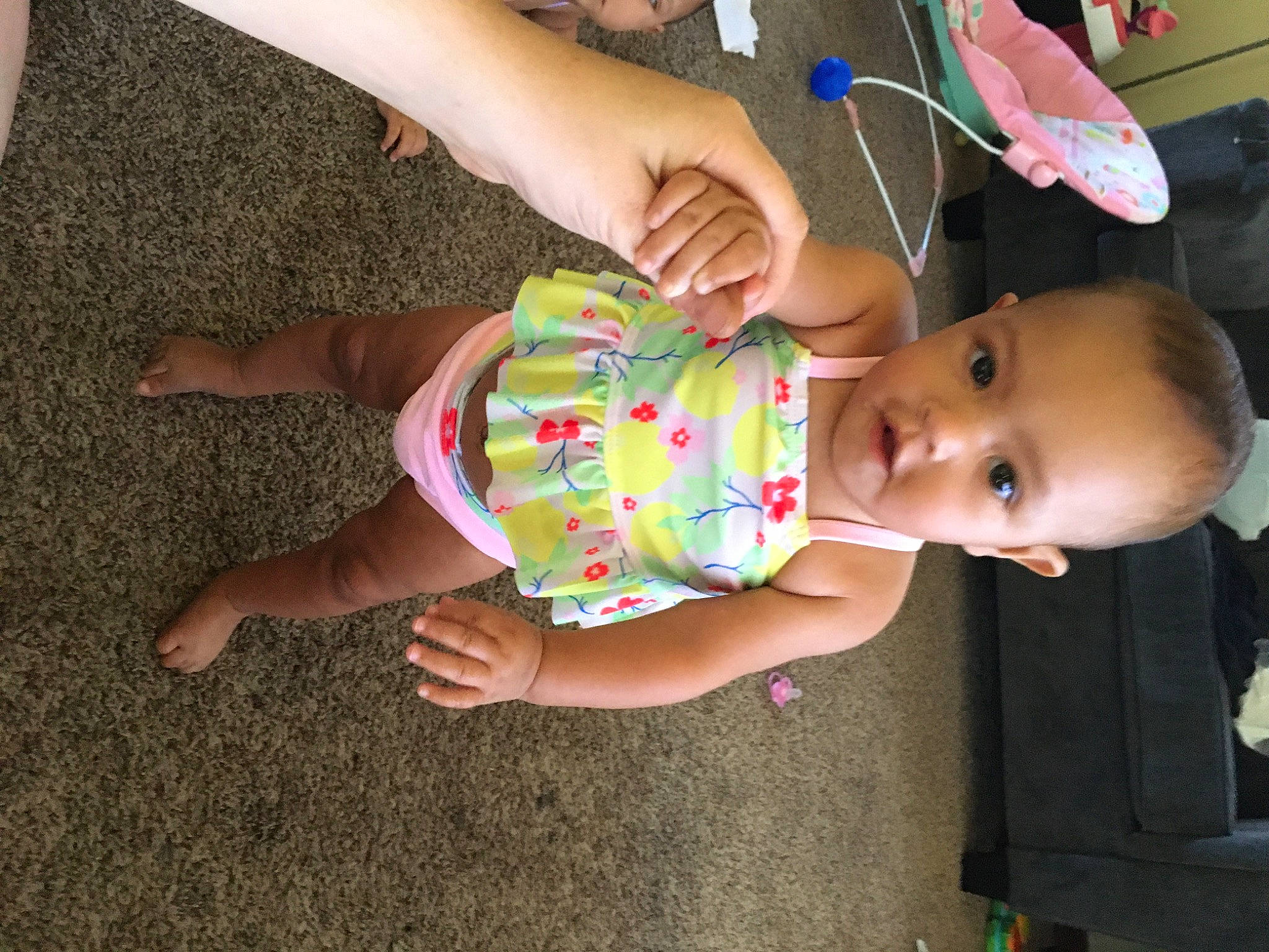 Jada is registered to the contest to win money with this photo: baby, baby_products, baby_toddler_clothing, cheek, child, finger, foot, fun, gesture, grass, hand, happy, human_leg, nail, person, play, skin, smile, thumb, toddler