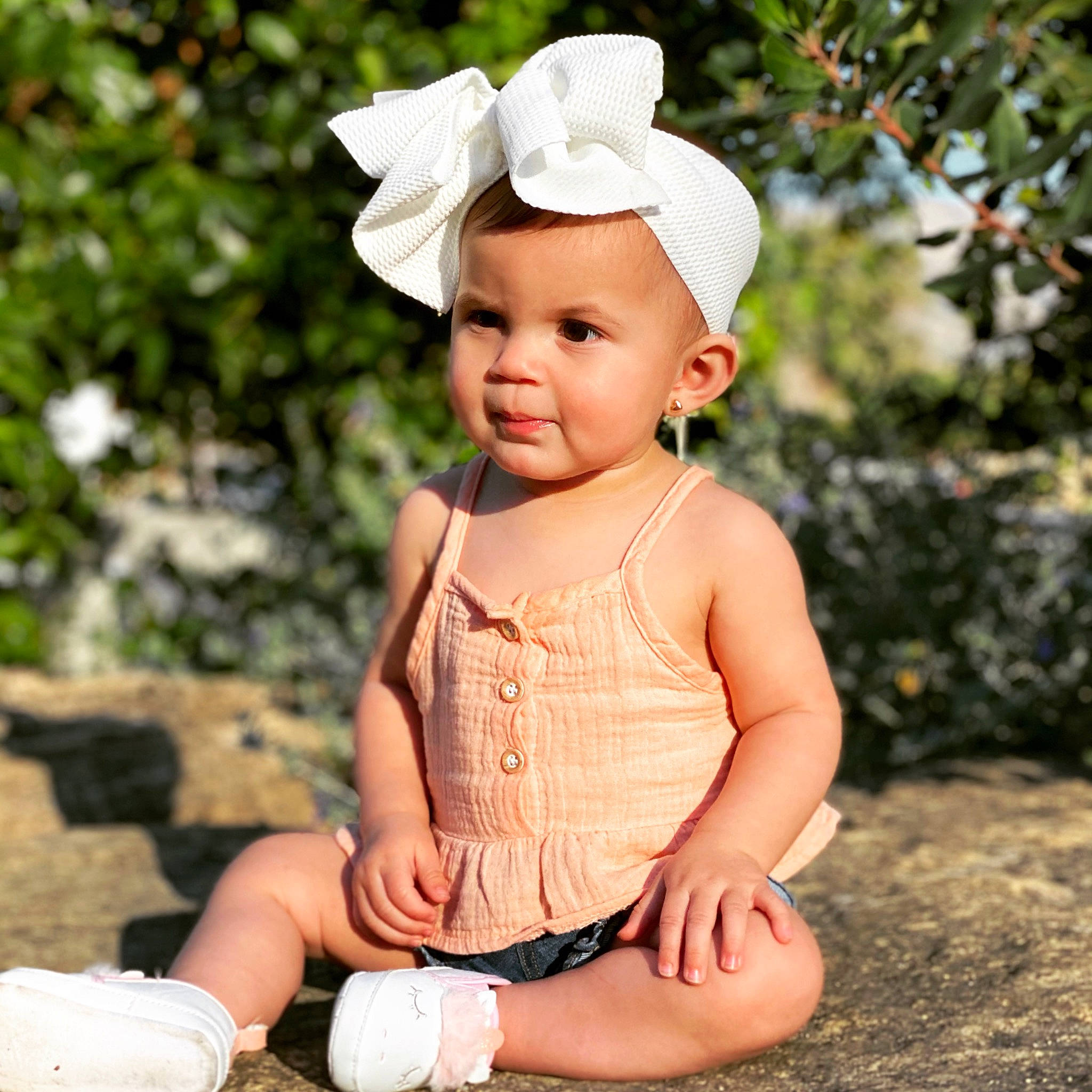 Jessica is registered to the contest to win money with this photo: baby, baby_toddler_clothing, child, clothing, eye, face, fashion_accessory, flash_photography, grass, happy, head, lip, pattern, people_in_nature, person, pink, plant, sitting, sleeve, toddler