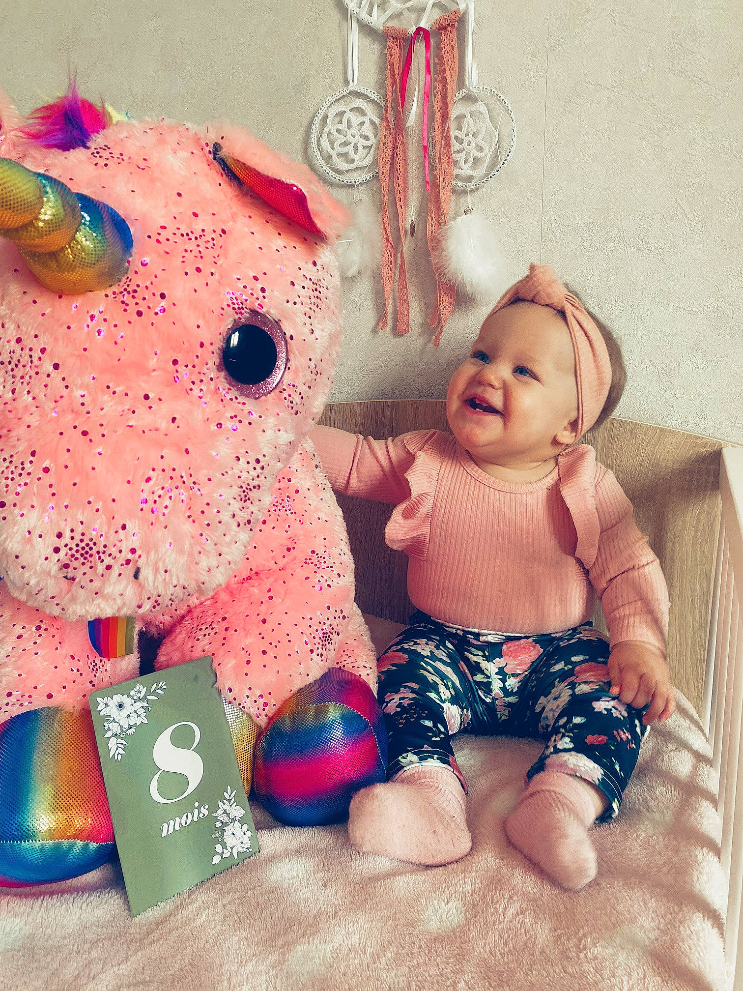 Lïyah participe au concours pour gagner de l'argent avec cette photo : art, baby, baby_toddler_clothing, carmine, fashion_accessory, foot, happy, headwear, joy, linens, magenta, mammal, pattern, person, pink, sleeve, smile, stuffed_toy, t_shirt, textile