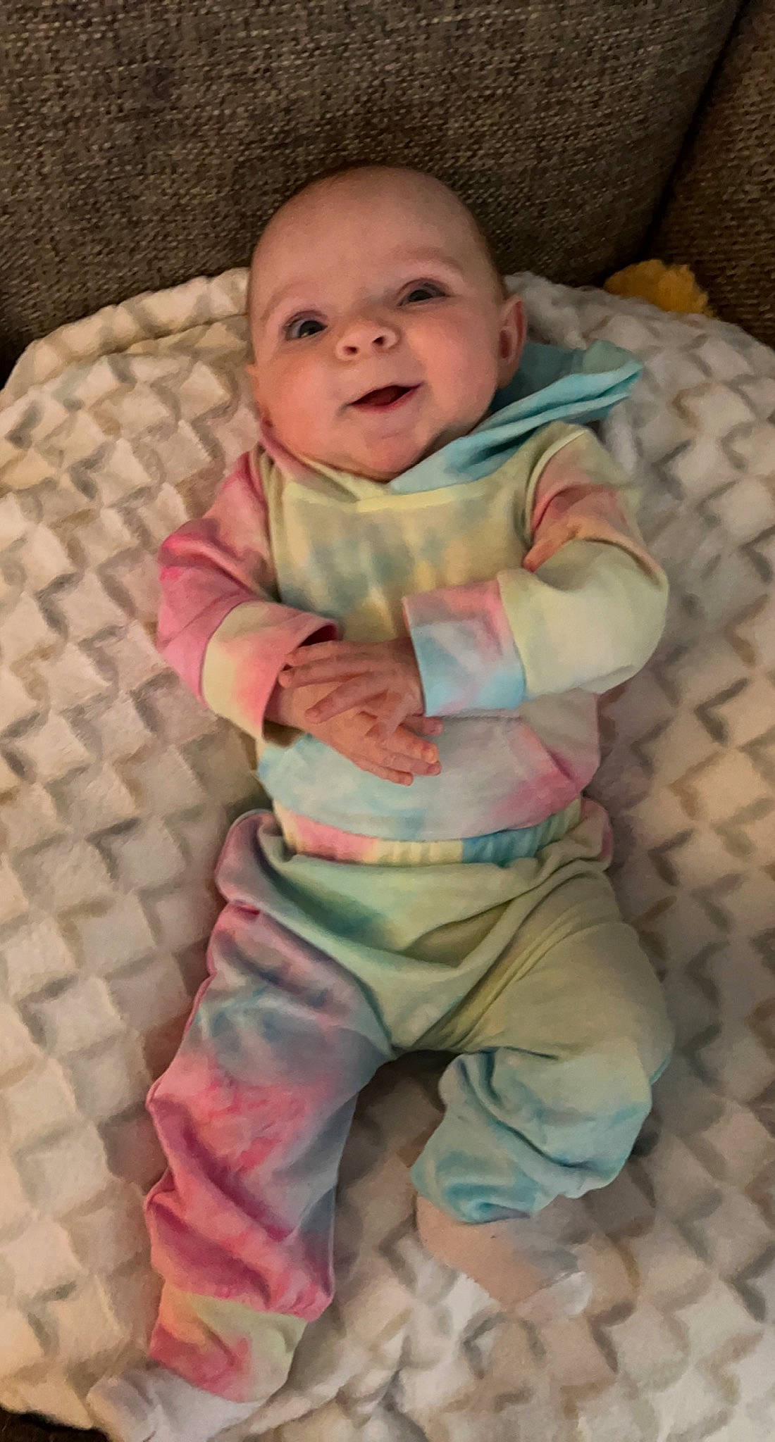 Paisley joined the competition — help win amazing prizes! baby, baby_toddler_clothing, cheek, child, comfort, eye, face, flooring, head, khaki_pants, linens, pattern, person, pink, sitting, skin, sleeve, smile, t_shirt, textile