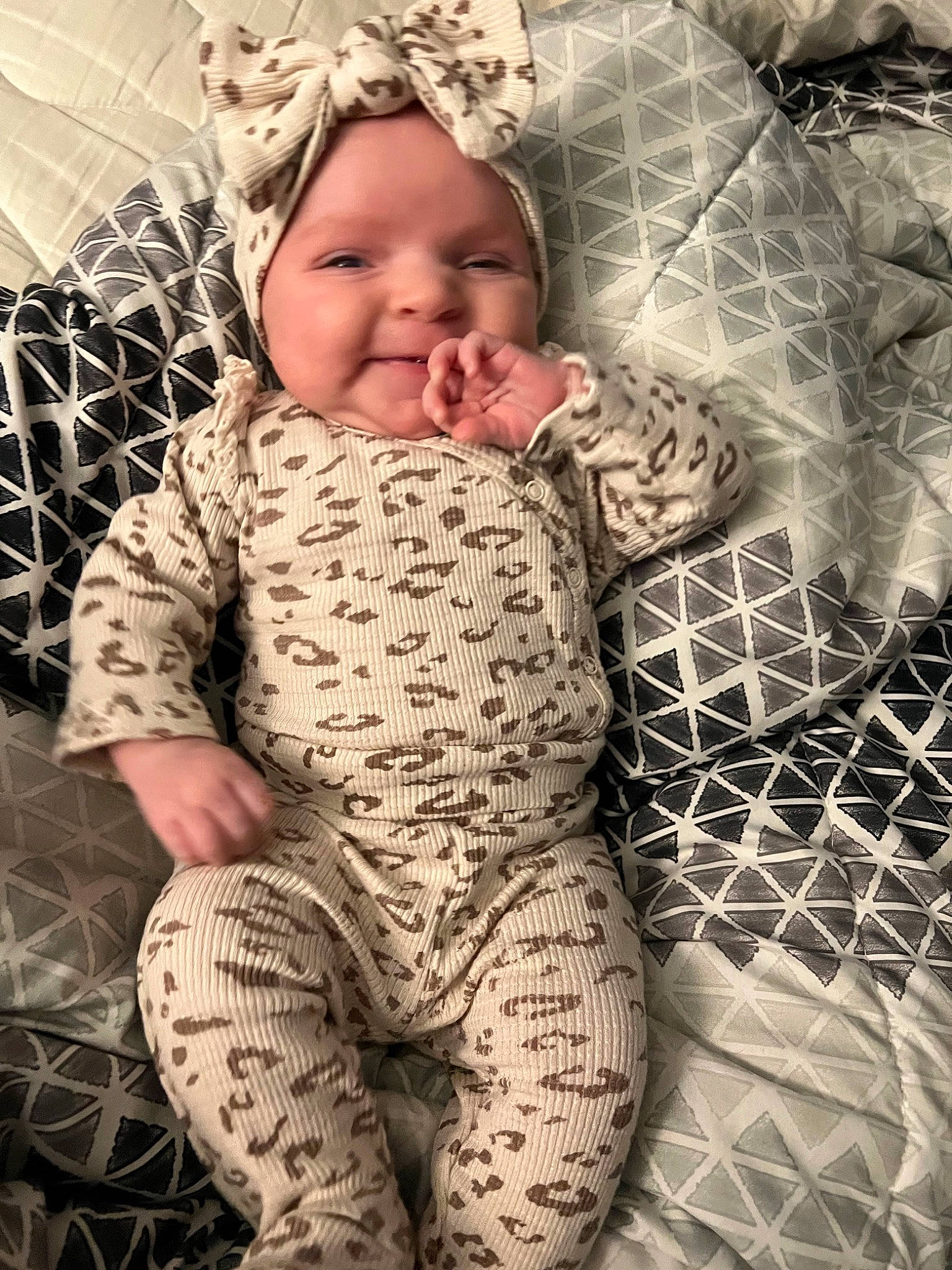 Paisley joined the competition — help win amazing prizes! baby, baby_toddler_clothing, child, comfort, eye, face, grass, hand, happy, head, headwear, human_body, linens, mesh, pattern, people_in_nature, person, skin, sleeve, smile