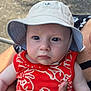 Ethan joined the competition — help win amazing prizes! baby, child, face, hat, bucket_hat, red_clothing, sleeveless_shirt, arm, hand, person, outdoor, portrait, infant, skin, expression, holding, closeup, summer, casual, cute