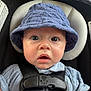 Ethan is registered to the contest to win money with this photo: baby, child, face, hat, bucket_hat, car_seat, seatbelt, blue_clothing, infant, curious, expression, closeup, straps, head_support, sitting, young_child, indoors, skin, eyes, mouth