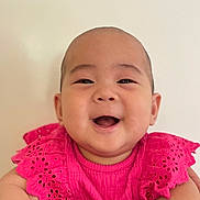 Aurora joined the competition — help win amazing prizes! baby, smiling, child, portrait, pink_dress, happy, face, cute, infant, closeup, innocent, cheerful, bright, young_child, person, studio, candid, joyful, fashion, expression