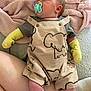 baby, infant, pacifier, clothing, romper, mittens, socks, blanket, elephant_print, soft_texture, resting, cute, indoors, child, person, sleeping, pink, yellow, purple, comfort