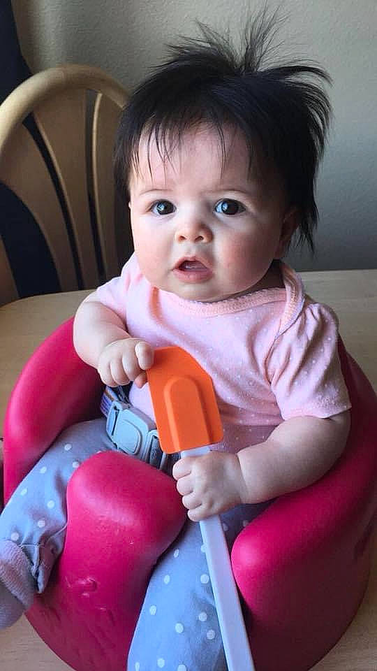 Mercy is registered to the contest to win money with this photo: baby, baby_products, baby_toddler_clothing, chair, cheek, child, comfort, eyelash, fun, happy, iris, lip, magenta, nail, nose, person, play, riding_toy, sitting, skin