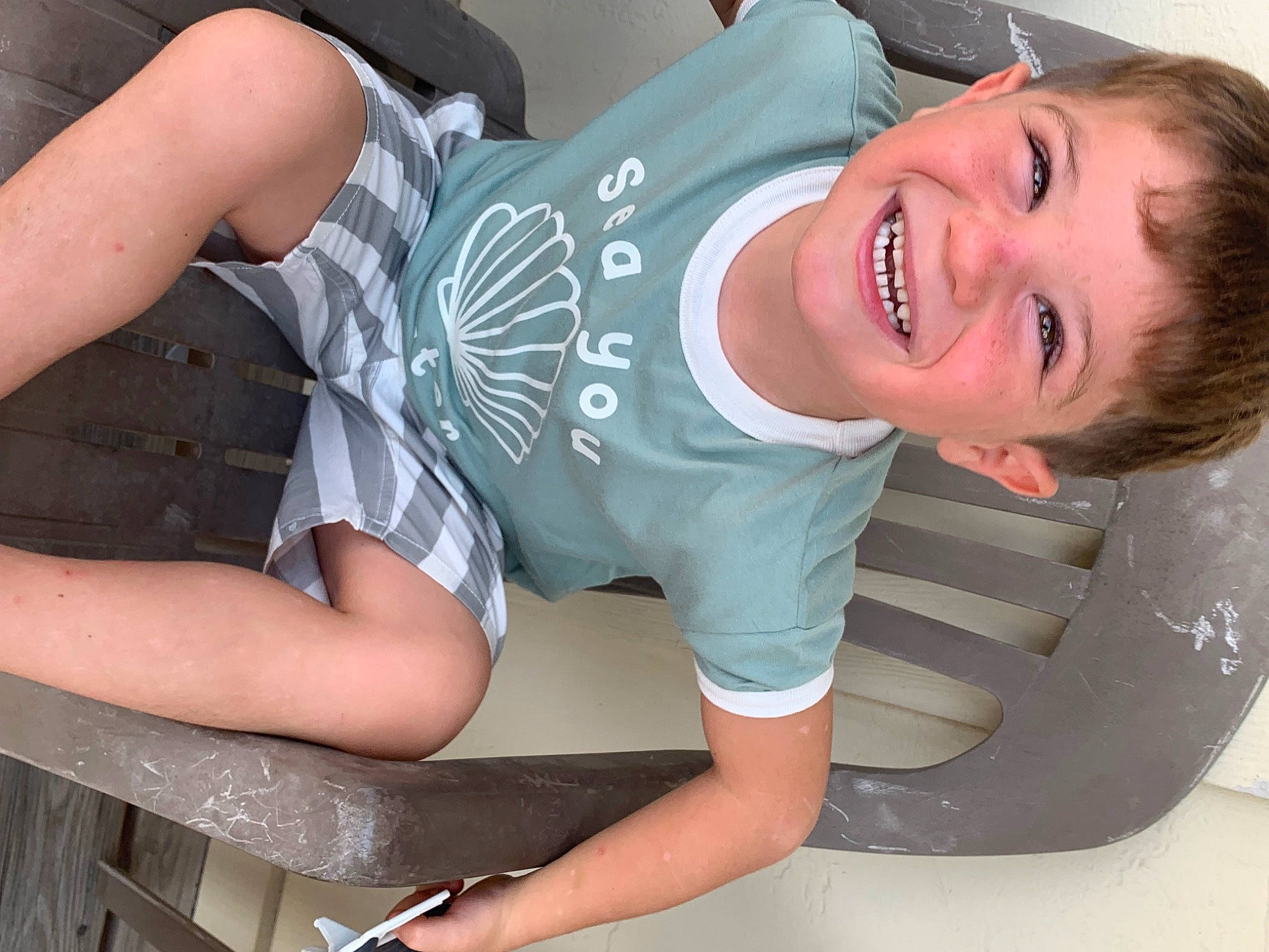 Mason is registered to the contest to win money with this photo: black_hair, comfort, cool, elbow, eyewear, flash_photography, hand, happy, human_body, jeans, joint, joy, knee, leg, mouth, neck, person, shoulder, skin, sleeve