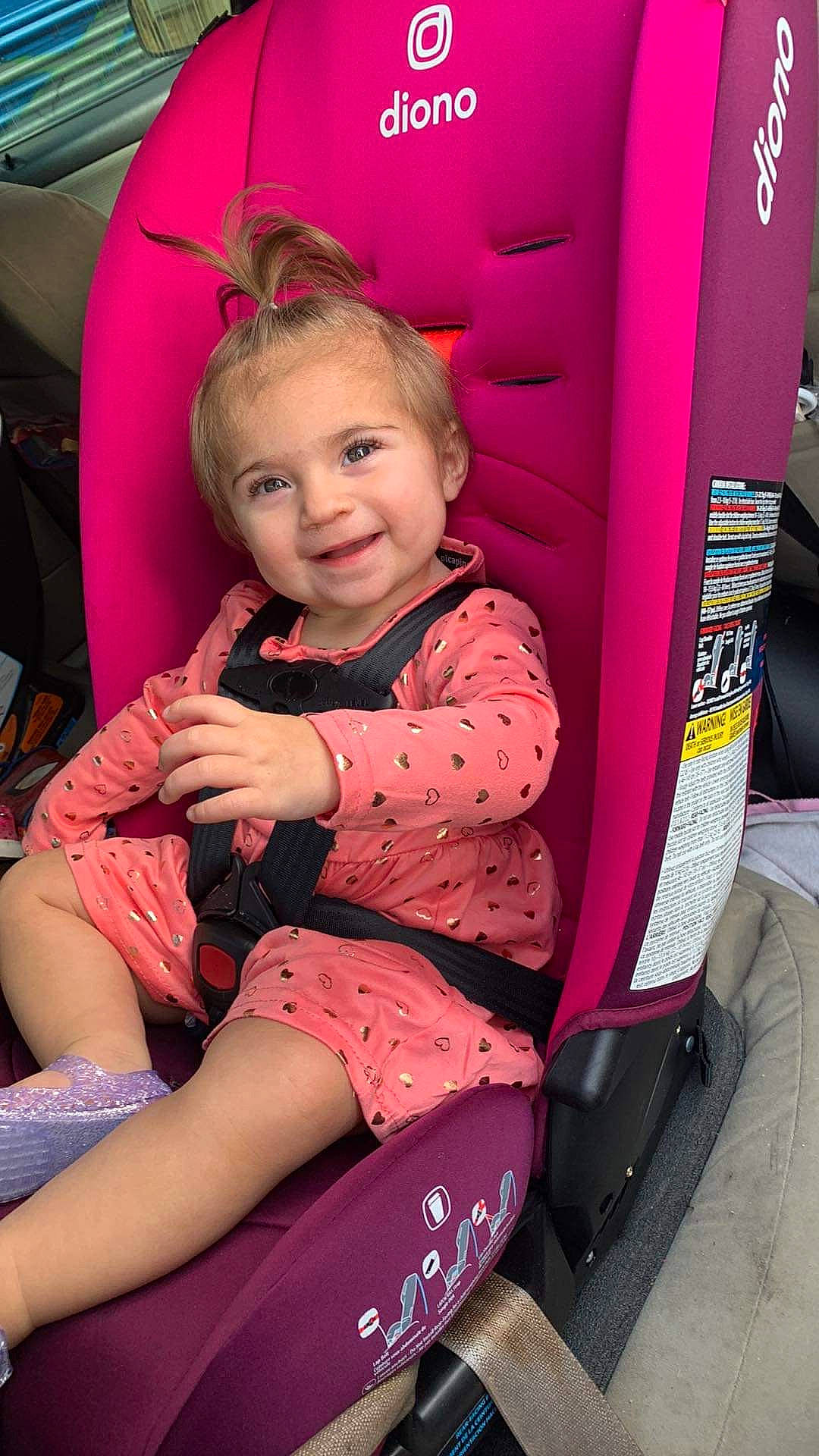 Azaria is registered to the contest to win money with this photo: auto_part, beauty, chair, child, comfort, fun, hairstyle, happy, joy, lap, leisure, magenta, motor_vehicle, person, pink, purple, red, sitting, skin, smile