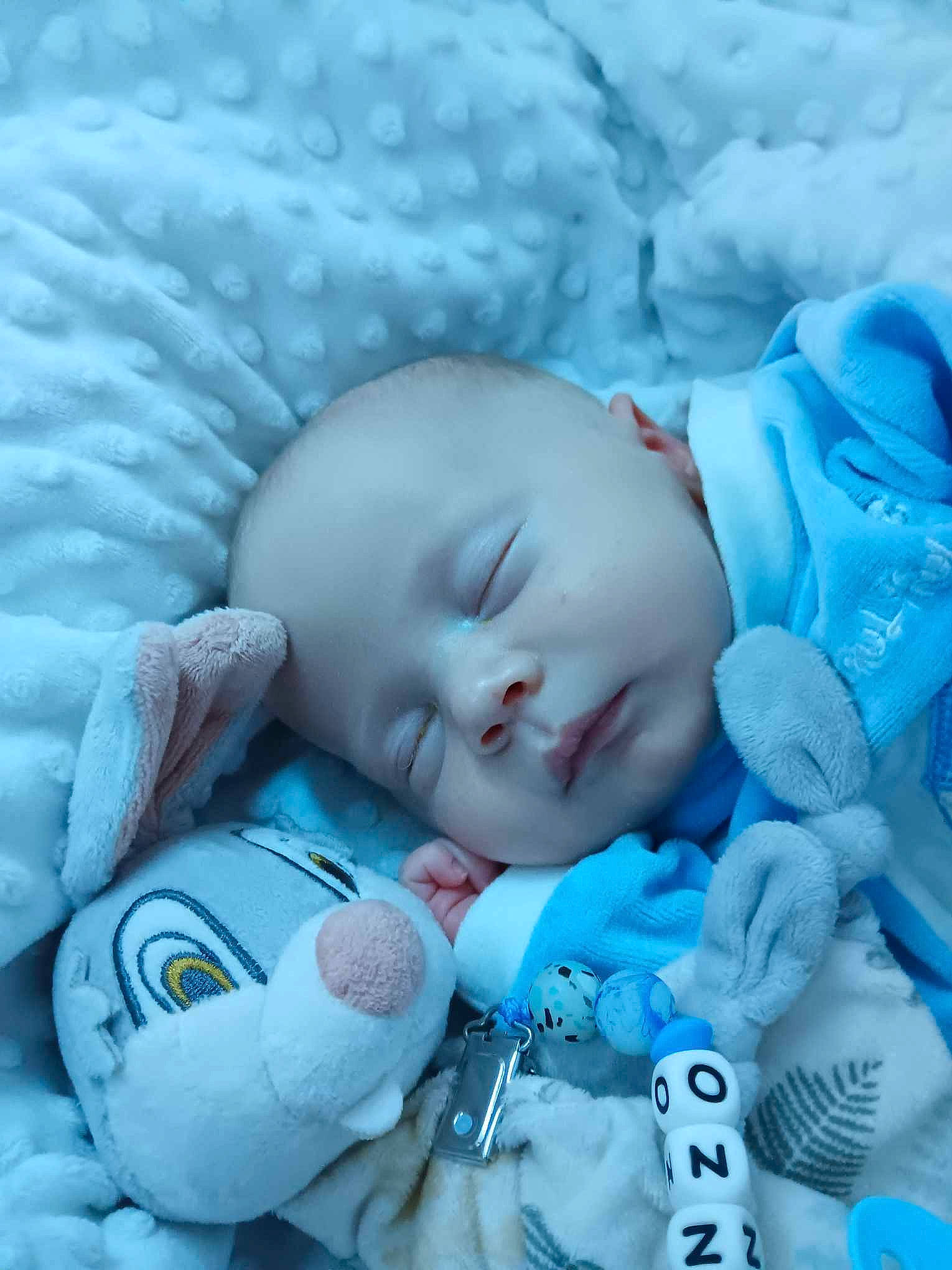 Kenzo a rejoint le concours — aidez-le/la à gagner de superbes lots ! azure, baby, baby_products, baby_sleeping, baby_toddler_clothing, bedtime, cheek, child, cloud, comfort, electric_blue, eye, head, iris, linens, mouth, nap, pattern, person, skin