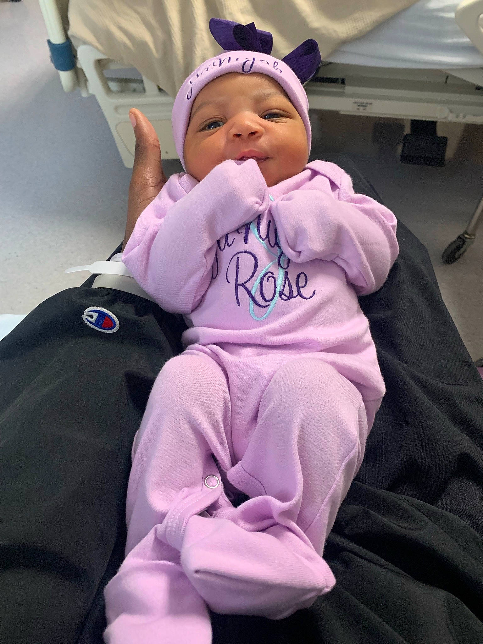 Janiyah joined the competition — help win amazing prizes! baby, baby_products, baby_toddler_clothing, cap, child, comfort, event, fun, happy, hat, leisure, magenta, person, purple, recreation, room, service, sitting, smile, t_shirt