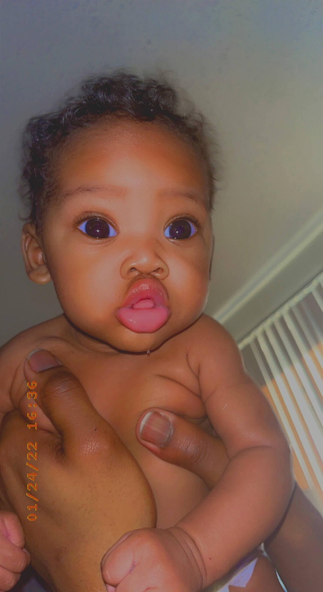 Harmonie is registered to the contest to win money with this photo: arm, baby, cheek, chin, ear, eye, eyebrow, eyelash, face, forehead, hair, head, human_body, lip, mouth, neck, nose, person, shoulder, skin