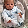 Jaylen joined the competition — help win amazing prizes! baby, infant, child, blue_clothing, cushion, seat, face, hands, eyes, blanket, indoor, soft_toys, baby_garment, cute, portrait, newborn, relaxed, comfort, expression, young