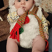 Azur participe au concours pour gagner de l'argent avec cette photo : baby, blanket, child, clothing, costume, cute, eyes, face, feet, furniture, hand, hat, indoor, infant, legs, pillow, portrait, scarf, sitting, snowman