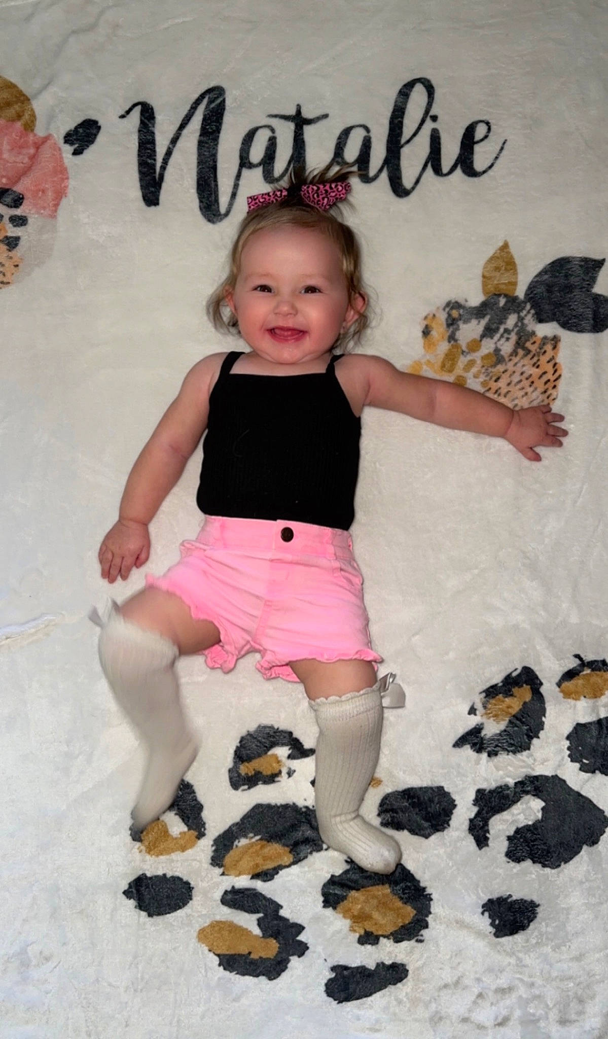 Natalie is registered to the contest to win money with this photo: baby_toddler_clothing, child, finger, font, fun, hairstyle, happy, joy, leg, pattern, person, pink, product, shorts, sleeve, smile, t_shirt, textile, thigh, toddler