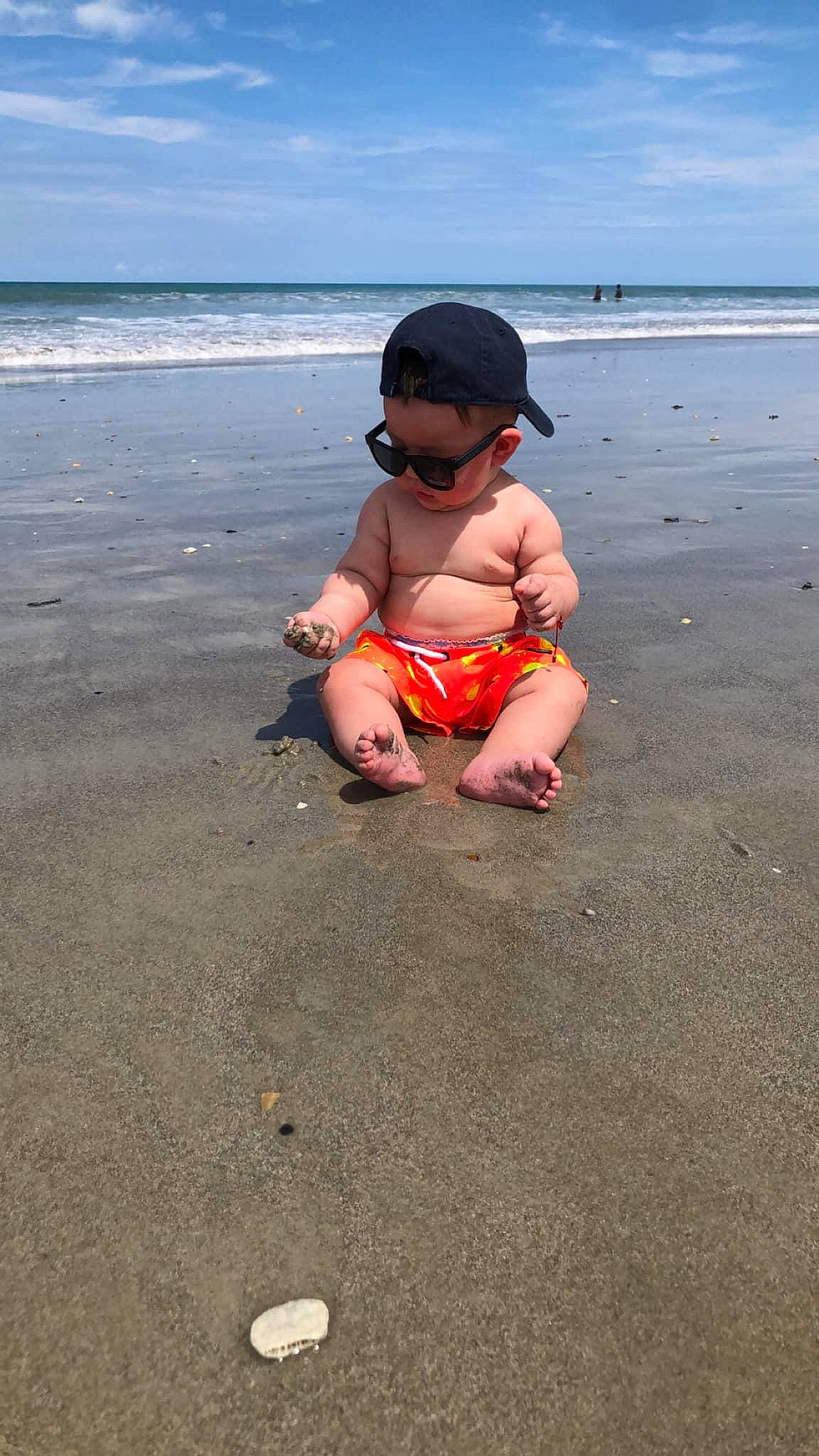 Jake joined the competition — help win amazing prizes! barefoot, beach, coastal_and_oceanic_landforms, fun, goggles, hand, hat, horizon, landscape, leg, leisure, people_on_beach, person, recreation, sand, shorts, sky, sunglasses, thigh, toddler