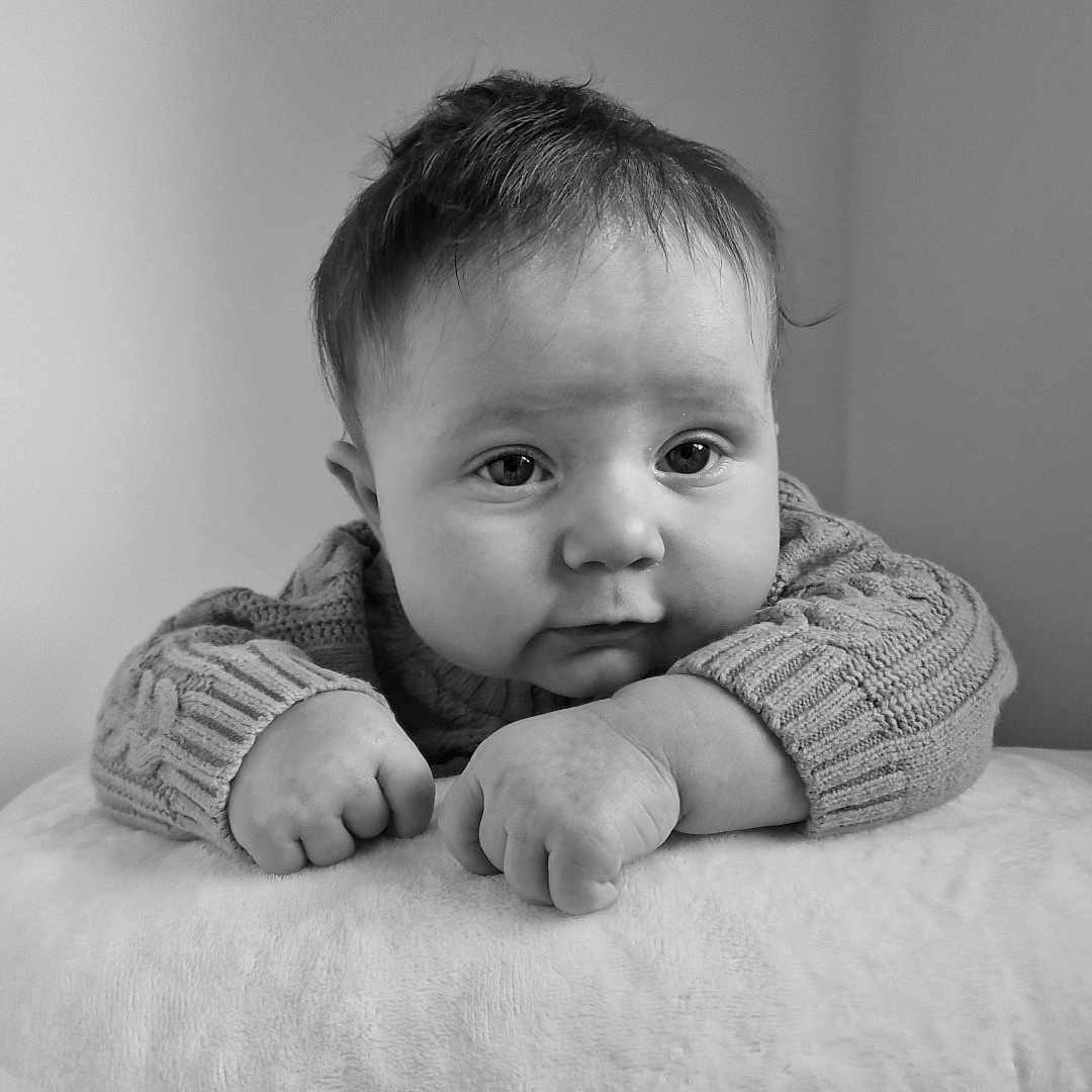 Rilee joined the competition — help win amazing prizes! baby, bodypart, clothing, face, finger, frown, furniture, hand, happy, head, indoors, knitwear, newborn, person, photography, portrait, sad, sitting, smile, sweater