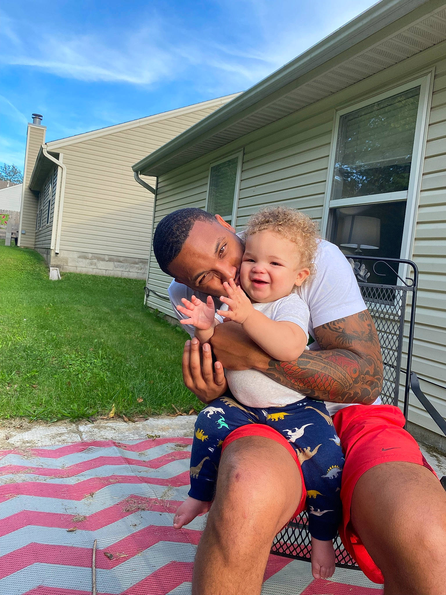 Rio joined the competition — help win amazing prizes! cloud, daytime, event, fun, grass, happy, house, human_leg, joy, lap, leg, leisure, person, recreation, shorts, sitting, sky, summer, t_shirt, thigh