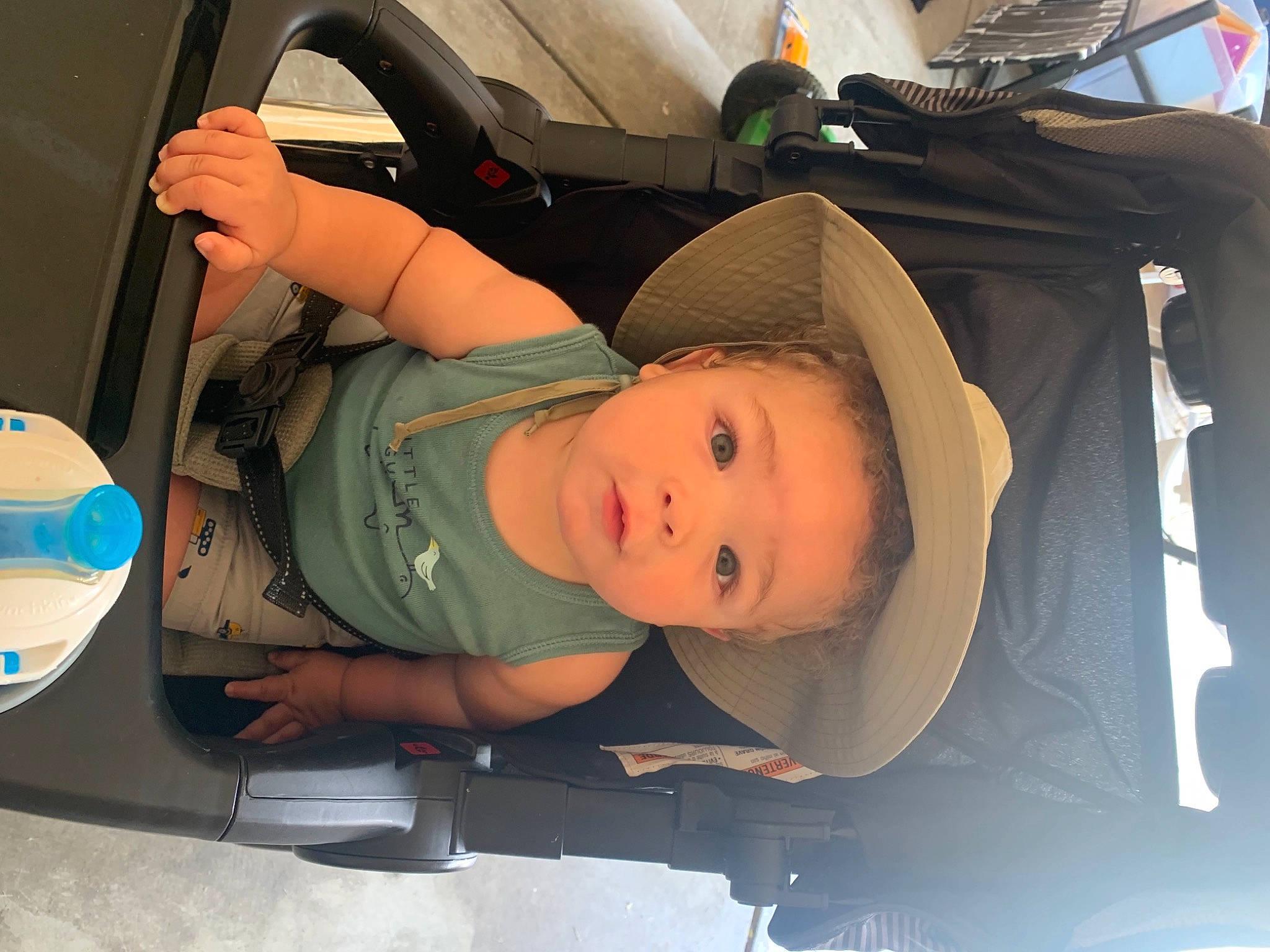 Rio is registered to the contest to win money with this photo: auto_part, automotive_design, automotive_exterior, baby, baby_carriage, baby_products, baby_safety, baby_toddler_clothing, bumper, car_seat, child, comfort, family_car, fun, hat, luxury_vehicle, motor_vehicle, person, toddler, trunk