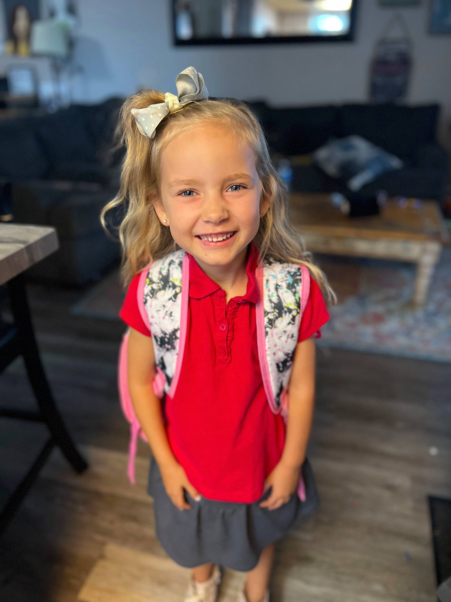 Malibu is registered to the contest to win money with this photo: baby_toddler_clothing, blond, child, event, fashion_accessory, floor, flooring, formal_wear, fun, hair, happy, hardwood, iris, joy, person, picture_frame, shoulder, skin, smile, television