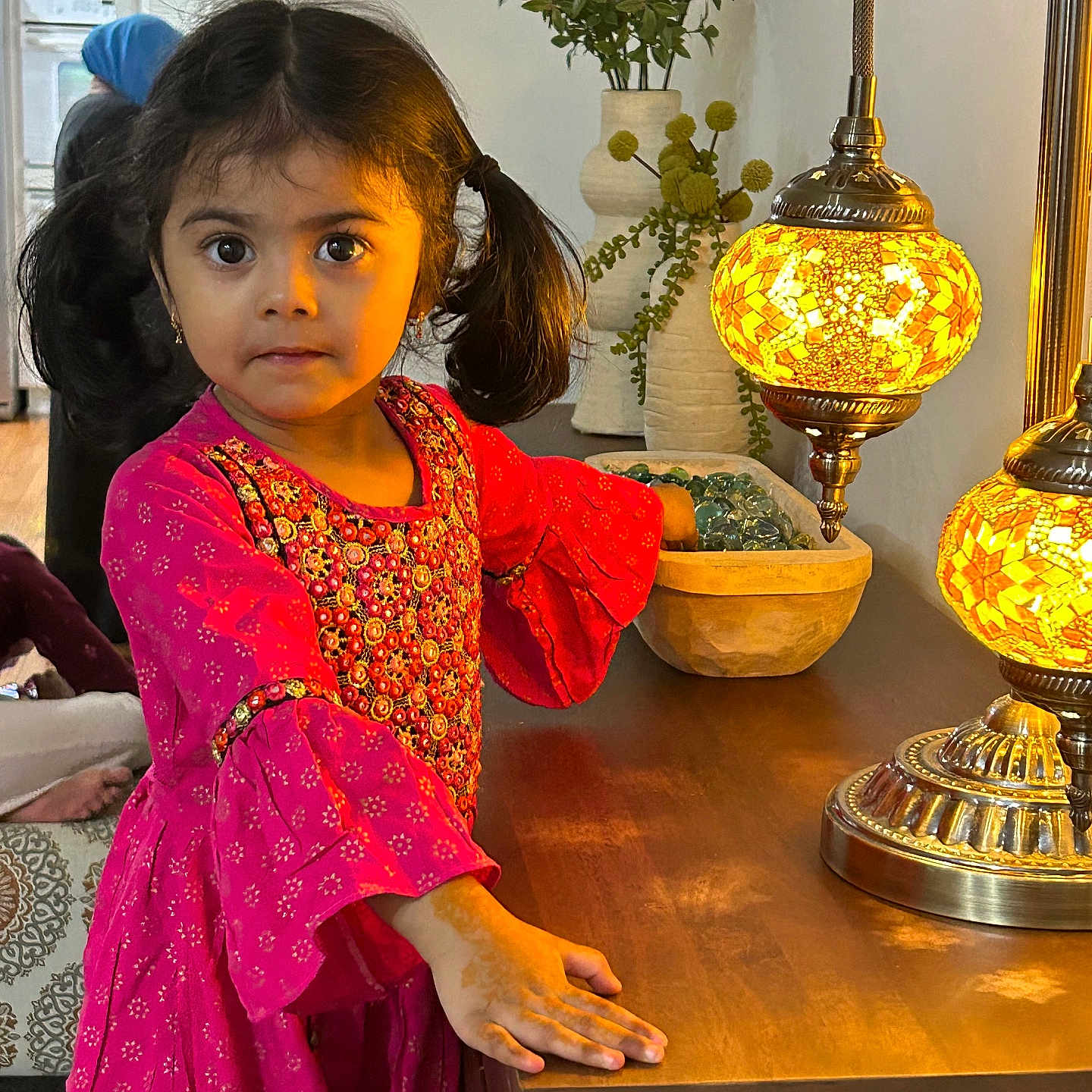 Nusaiba is registered to the contest to win money with this photo: adult, child, clothing, dress, face, female, flower, girl, hardwood, head, indoors, interiordesign, lamp, male, man, person, photography, portrait, woman, wood
