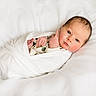 newborn, baby, swaddled, blanket, white, infant, cute, face, rosy_cheeks, lying_down, soft, peaceful, portrait, small_hands, sleepwear, bed, cozy, fresh, closeup, child