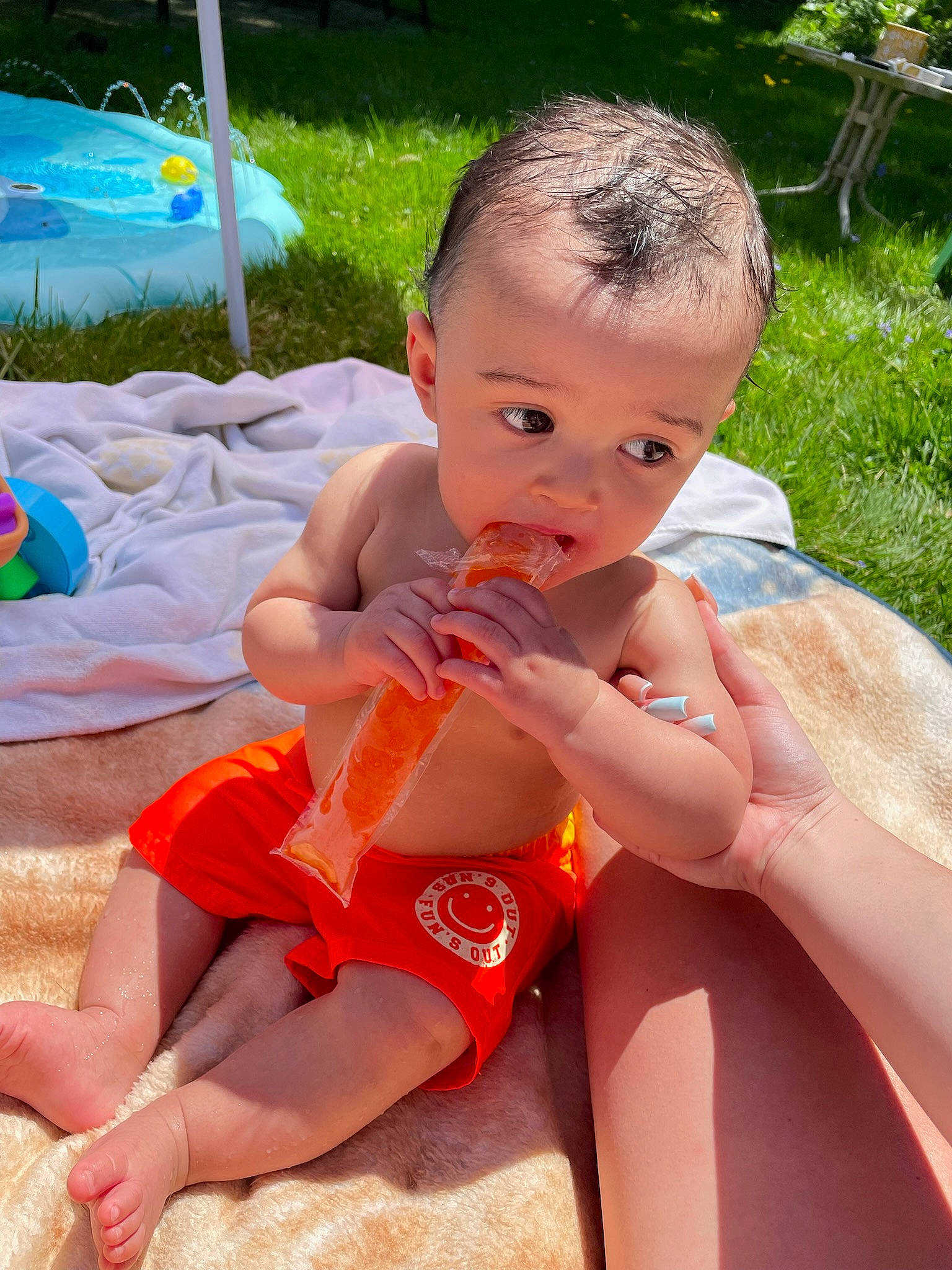 Nehemiah is registered to the contest to win money with this photo: baby, baby_toddler_clothing, chest, child, facial_expression, finger, fun, grass, hairstyle, happy, leg, leisure, nail, person, plant, skin, summer, thigh, thumb, toddler