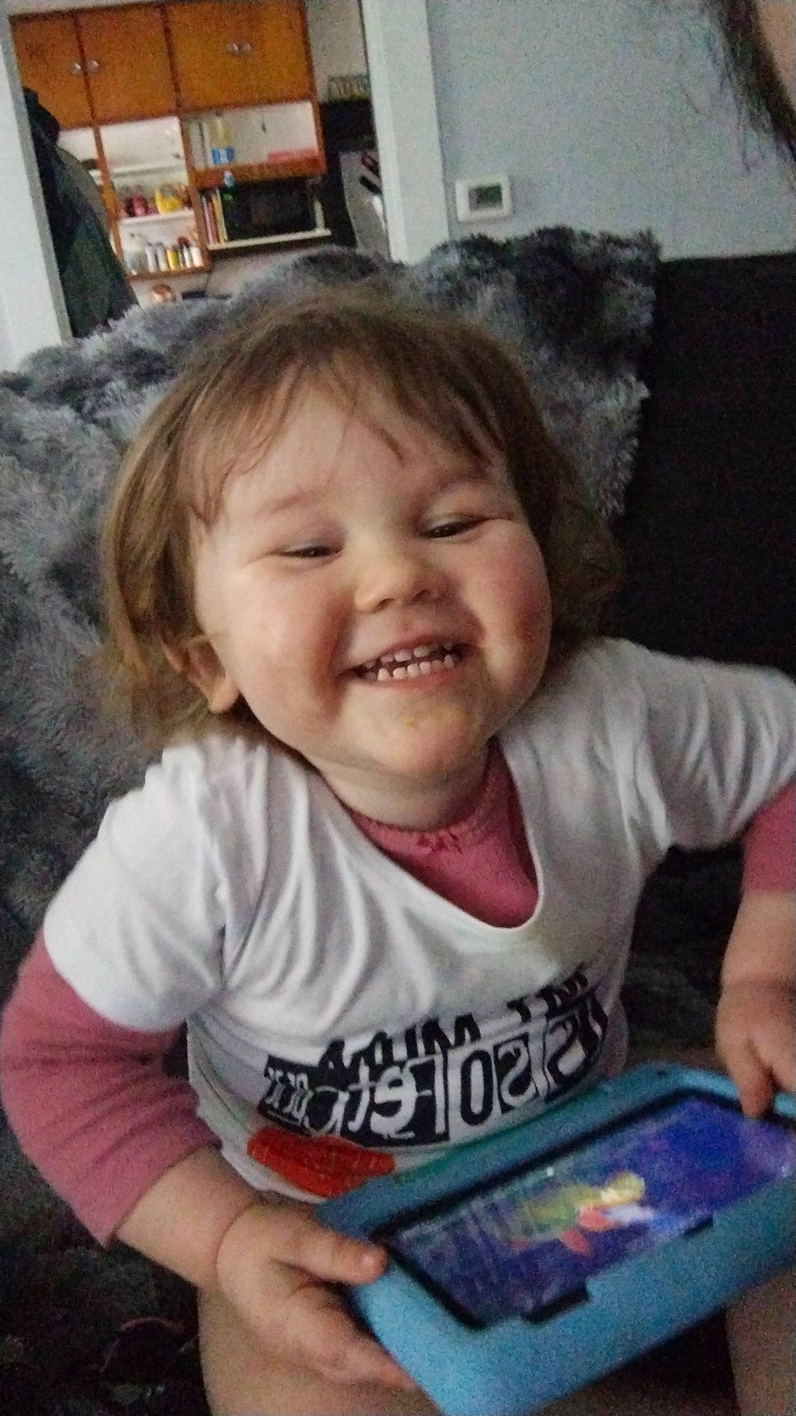 Kenzley joined the competition — help win amazing prizes! baby, baby_laughing, baby_toddler_clothing, cheek, child, cool, couch, fun, happy, iris, joy, laugh, lip, mouth, nose, person, sitting, skin, sleeve, smile