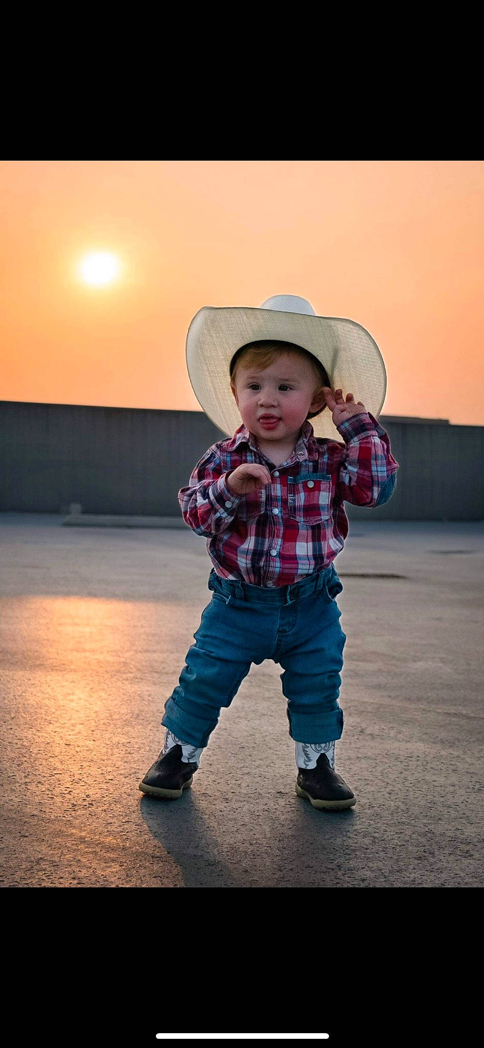 Zyaire is registered to the contest to win money with this photo: baby_toddler_clothing, child, clothing, cool, denim, electric_blue, flash_photography, fun, happy, hat, jeans, outerwear, people_in_nature, person, sky, sleeve, smile, standing, sun_hat, sunlight