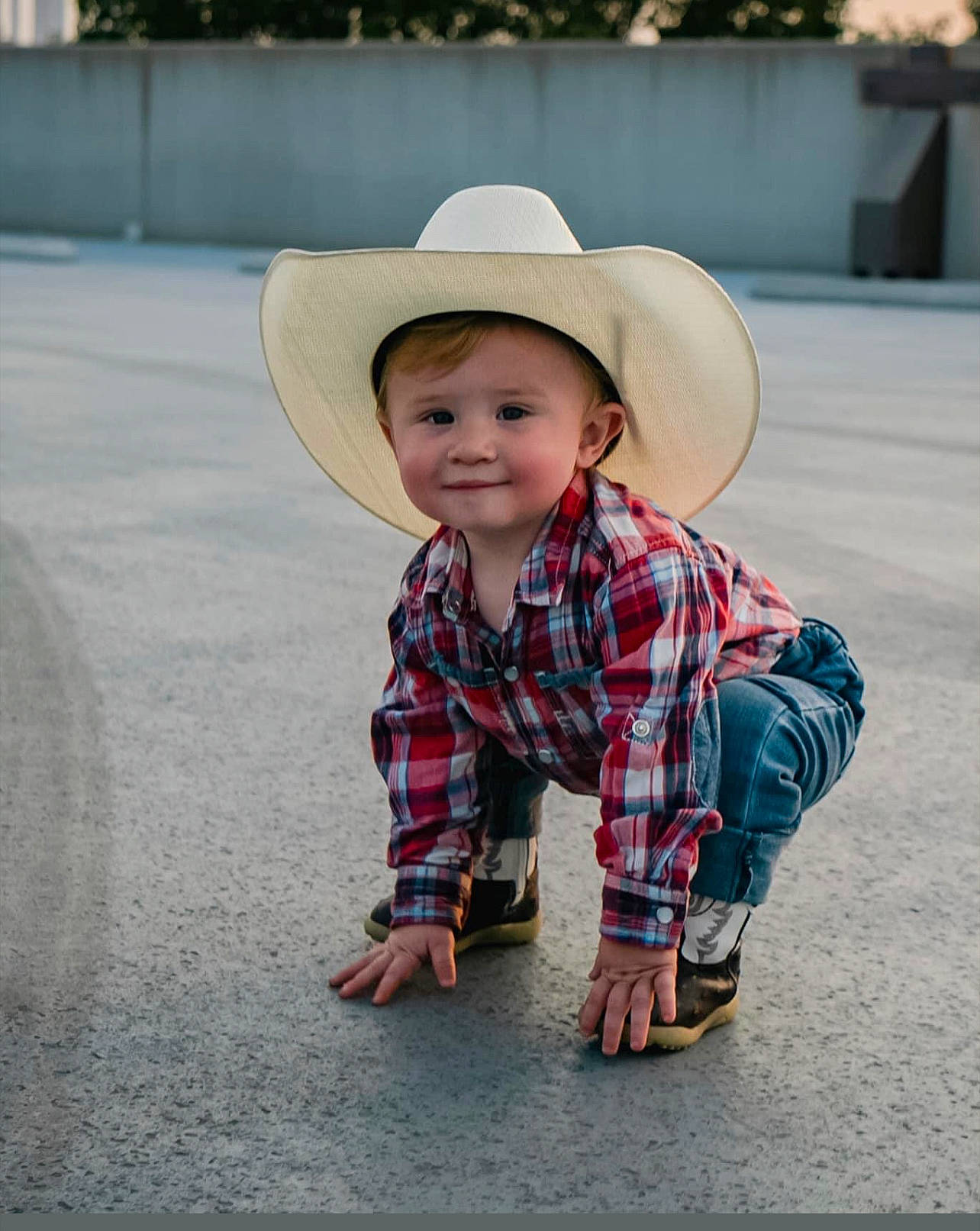 Zyaire joined the competition — help win amazing prizes! baby_toddler_clothing, child, cowboy_hat, eye, fun, grass, happy, hat, headgear, joy, leisure, pattern, person, plaid, plant, road_surface, sitting, sleeve, smile, sun_hat