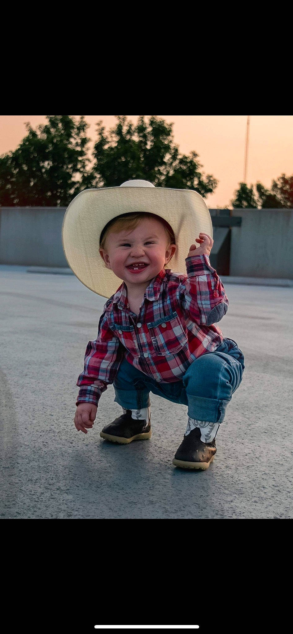 Zyaire is registered to the contest to win money with this photo: baby_toddler_clothing, cowboy_hat, flash_photography, footwear, grass, happy, hat, headgear, jeans, joy, pattern, person, plaid, plant, shoe, sleeve, smile, sneakers, sun_hat, tartan