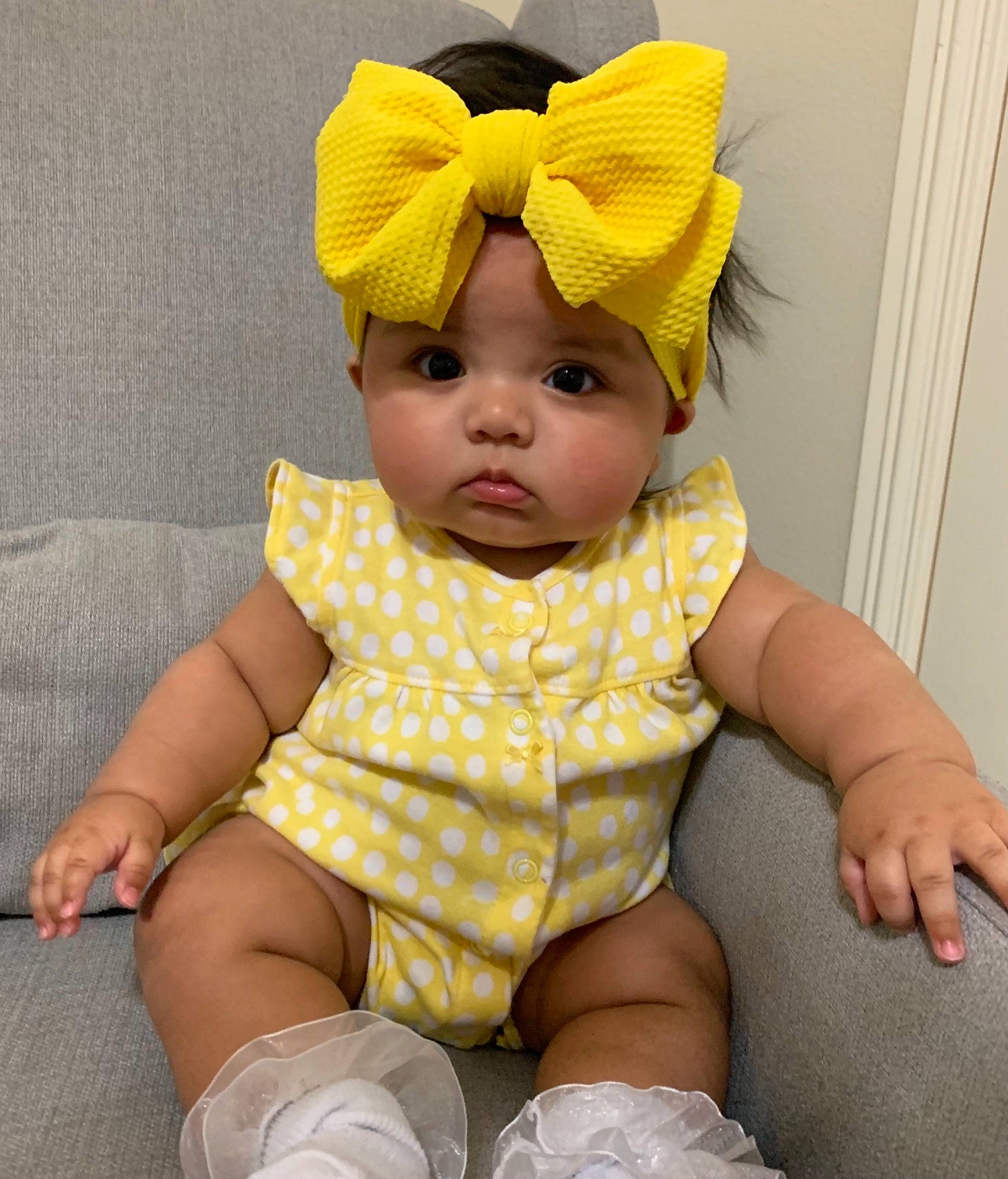 Rachel is registered to the contest to win money with this photo: baby, baby_products, baby_safety, baby_toddler_clothing, cap, cheek, child, comfort, costume_hat, eye, face, headwear, human_body, human_leg, knit_cap, linens, pattern, person, sleeve, toddler