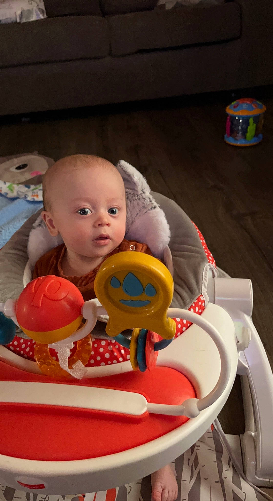 Ryker joined the competition — help win amazing prizes! baby, baby_playing_with_toys, baby_products, baby_toys, bathing, chair, child, doll, figurine, fun, orange, person, plastic, play, riding_toy, room, sitting, stuffed_toy, surprise, toddler