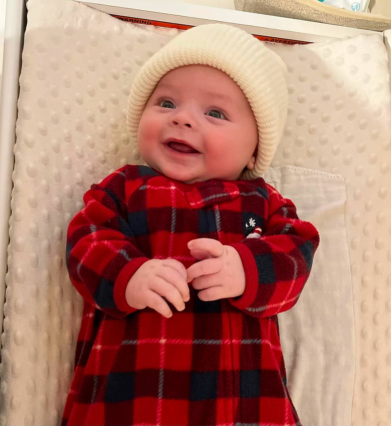Ellis is registered to the contest to win money with this photo: baby, baby_toddler_clothing, child, clothing, collar, day_dress, dress, face, happy, headwear, linens, one_piece_garment, pattern, person, plaid, red, sleeve, smile, tartan, textile