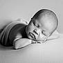 Theo is registered to the contest to win money with this photo: baby, newborn, sleeping, black_and_white, infant, peaceful, resting, portrait, soft_focus, cute, child, face, head, skin, blanket, closeup, young, lying_down, calm, serene