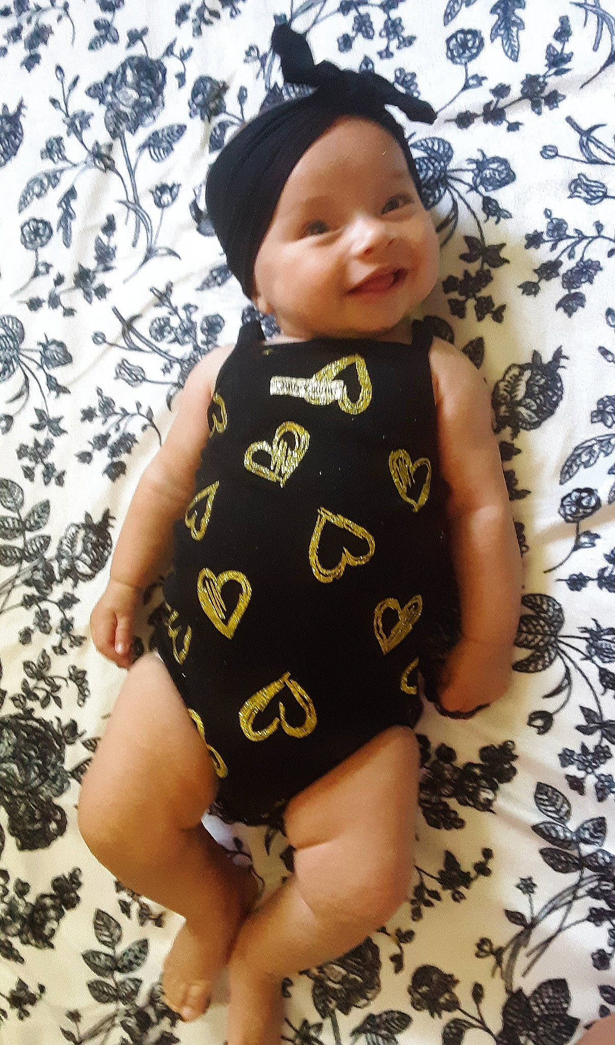 Ruby is registered to the contest to win money with this photo: baby, baby_products, baby_toddler_clothing, cap, child, clothing, headgear, headwear, joy, pattern, person, product, toddler