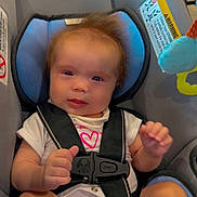 Isabella joined the competition — help win amazing prizes! baby, car_seat, infant, child, seat_belt, safety_harness, toy, indoor, clothing, cute, face, head_support, diaper, expression, person, pink_heart, white_shirt, furniture, light, comfort