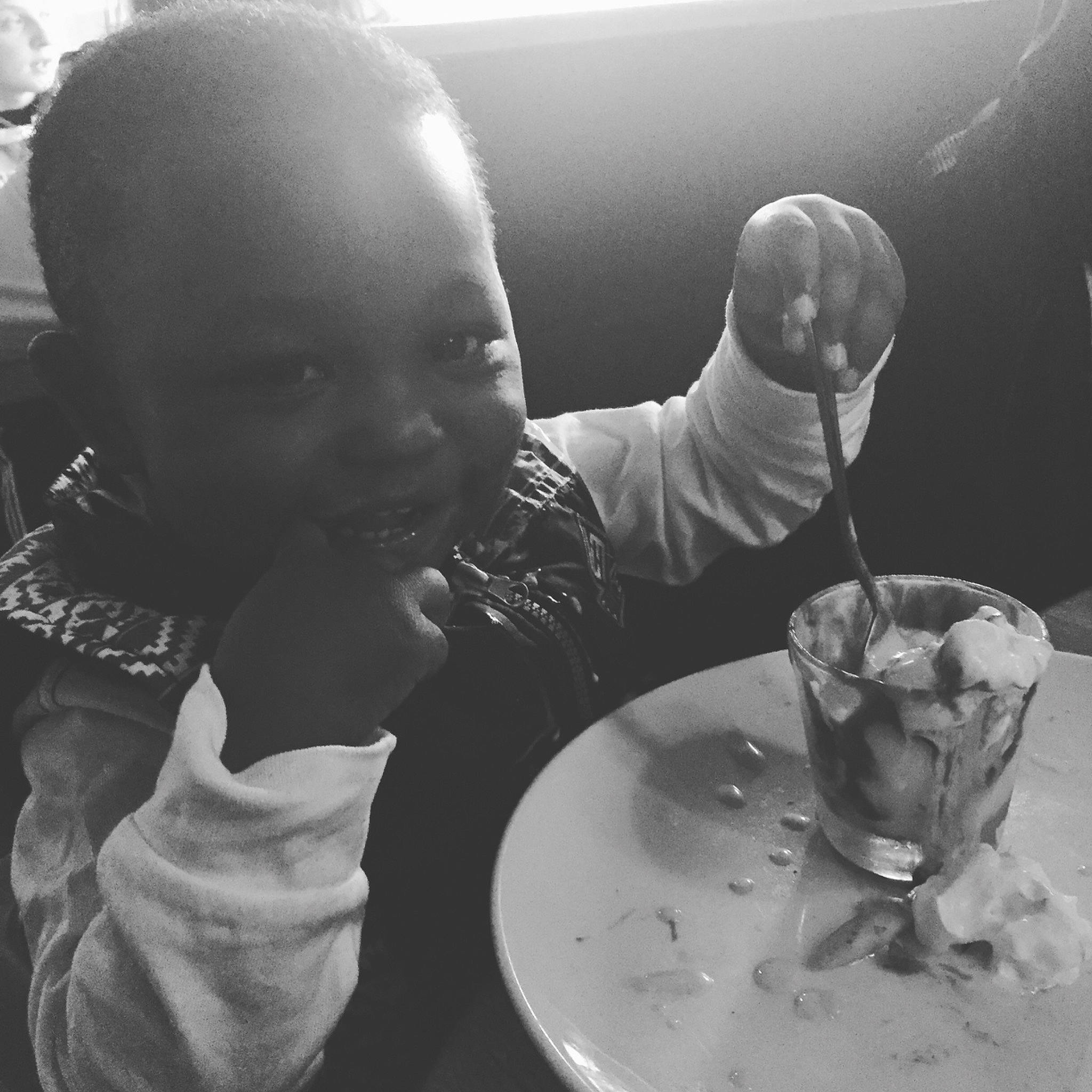London is registered to the contest to win money with this photo: black_and_white, child, dish, eating, food, monochrome, monochrome_photography, person, photography, style, water