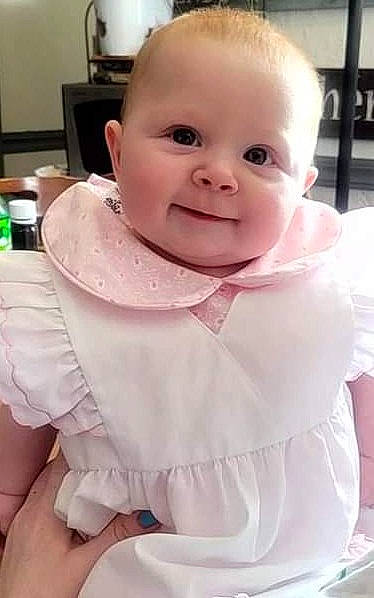 Stormee joined the competition — help win amazing prizes! baby, baby_toddler_clothing, cheek, child, chin, dress, face, finger, flooring, fun, happy, iris, joy, lip, neck, person, pink, sitting, skin, sleeve