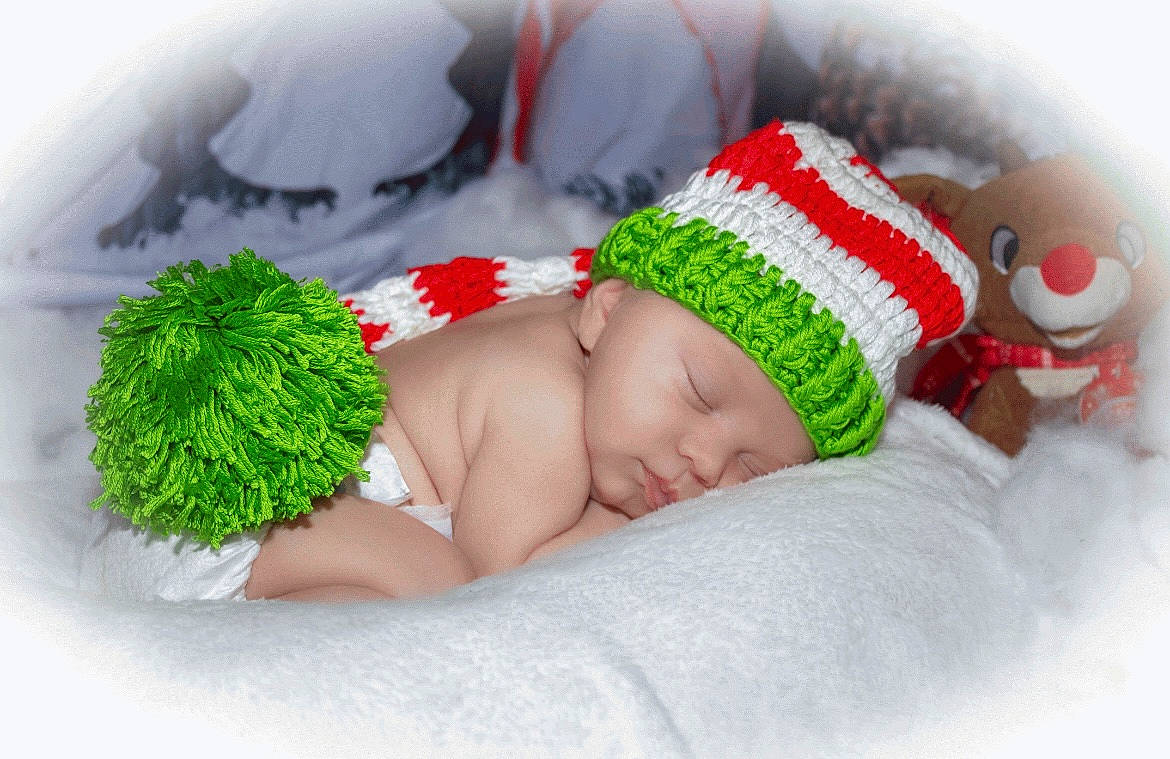 Elliot is registered to the contest to win money with this photo: baby, baby_sleeping, baby_toddler_clothing, bedding, cap, child, comfort, costume_hat, event, fashion_accessory, finger, fur, grass, happy, headwear, knit_cap, linens, person, product, room