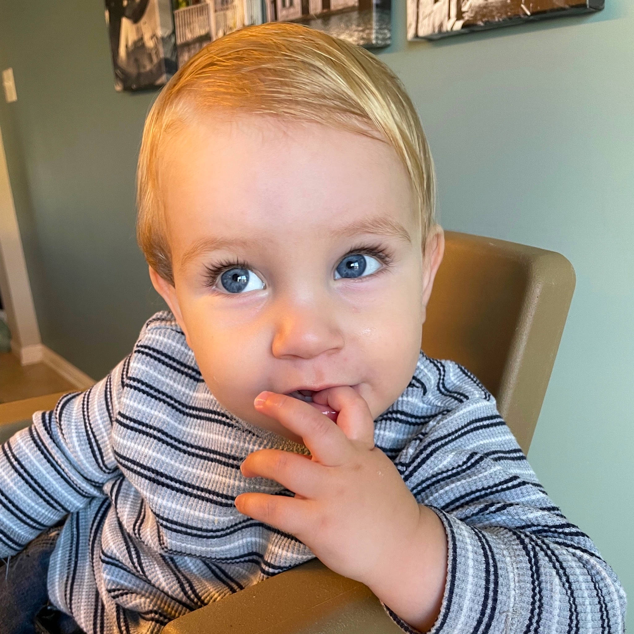 Ben is registered to the contest to win money with this photo: arm, baby_toddler_clothing, cheek, chin, ear, eyebrow, eyelash, finger, forehead, gesture, hand, iris, jaw, lip, mouth, neck, nose, person, picture_frame, skin