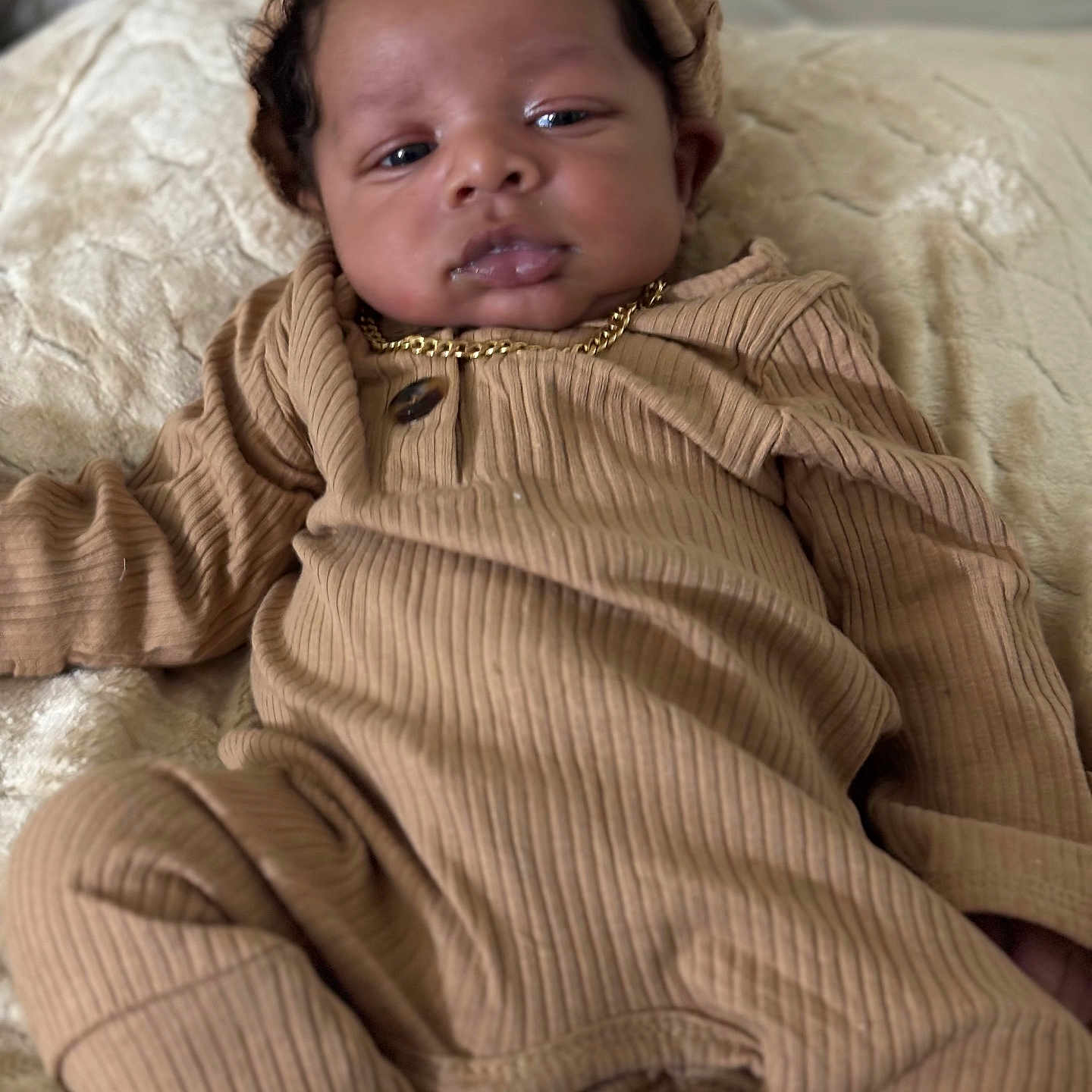 Ihsan is registered to the contest to win money with this photo: accessories, baby, cap, clothing, couch, face, furniture, happy, hat, head, hood, hoodie, jewelry, knitwear, necklace, person, photography, portrait, smile, sweater