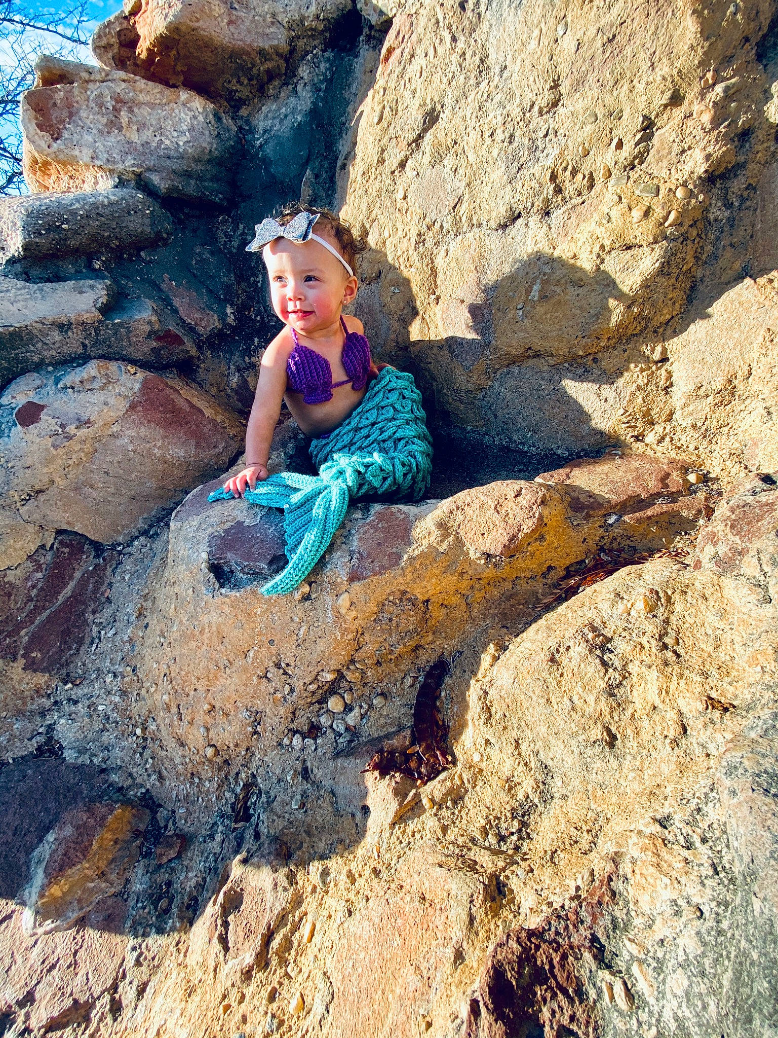 Kaizlee is registered to the contest to win money with this photo: adventure, beauty, bedrock, blue, cliff, formation, fun, geological_phenomenon, geology, joy, leisure, outcrop, person, photograph, photography, recreation, rock, rock_climbing, sand, sitting