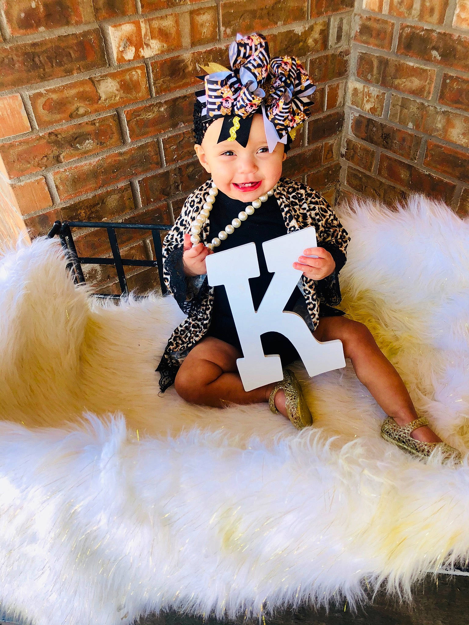 Kaizlee is registered to the contest to win money with this photo: child, child_model, clothing, costume, costume_accessory, costume_hat, crown, fashion, fashion_accessory, fur, fur_clothing, hair_accessory, headpiece, headwear, joy, person, toddler