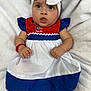 baby, child, dress, headband, bow, blanket, red, white, blue, face, eyes, hand, arm, person, infant, cute, portrait, sitting, clothing, soft