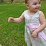 Hazel is registered to the contest to win money with this photo: toddler, child, grass, outdoor, dress, pink_bow, forest, greenery, smile, young_child, nature, cute, playful, person, footwear, white_tights, baby, daylight, portrait, happy